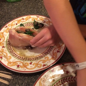 Connor stuffing his chicken breasts